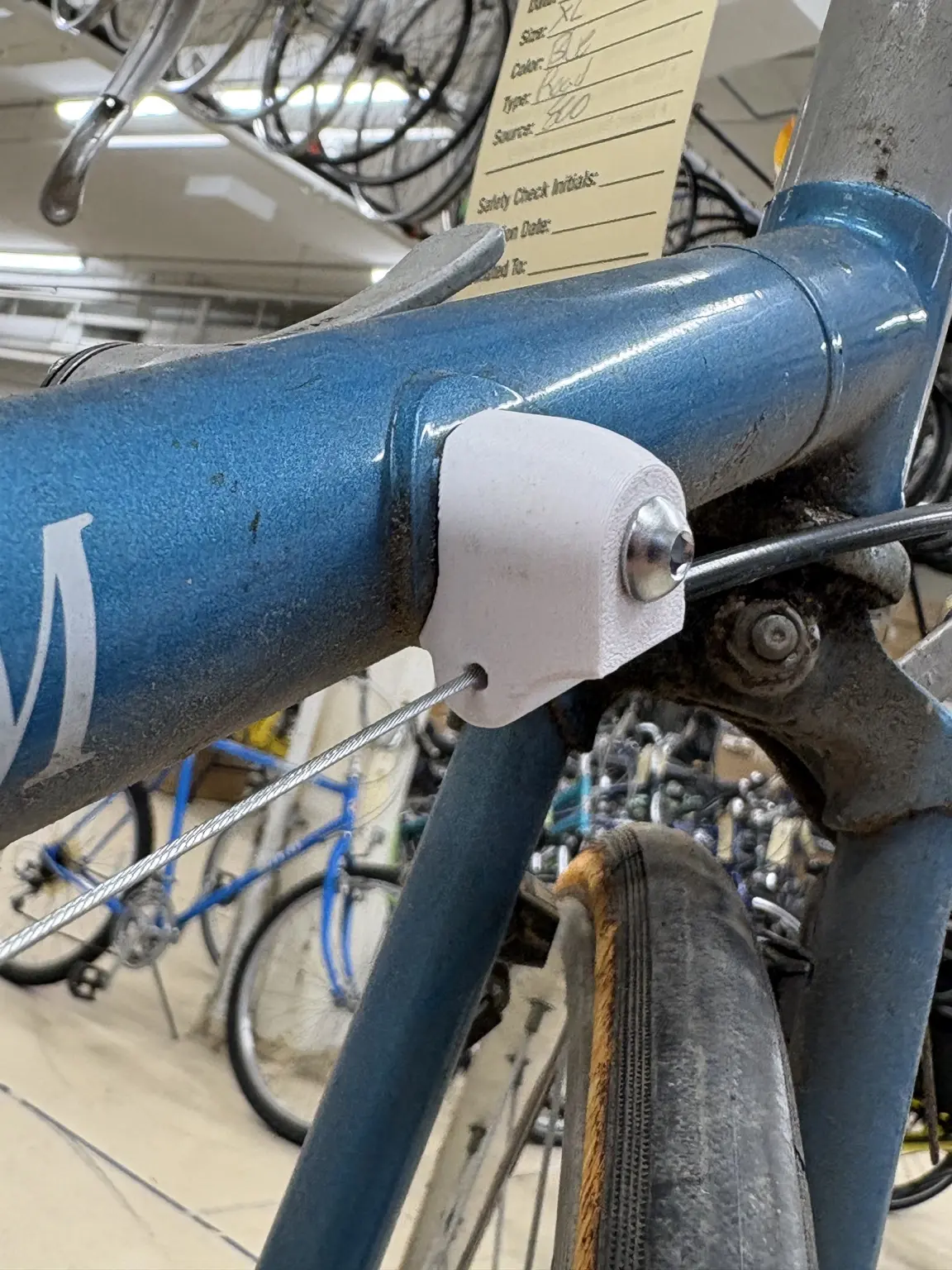 Shifter cable housing stop installed on a bicycle